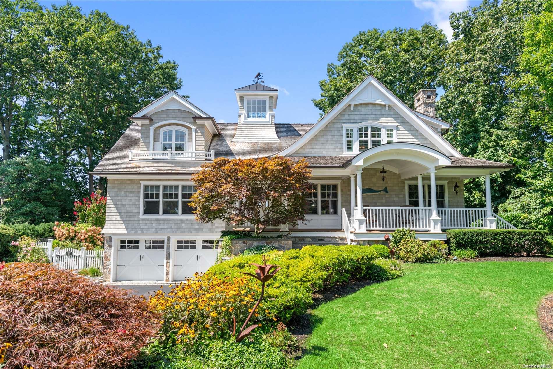 7 Halyard Court Cold Spring Harbor, NY 11724 - Photo 1 of 1 a front view of a house with a yard