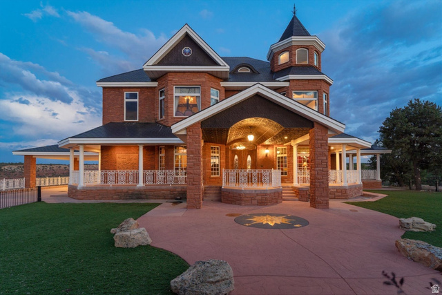 5615 East Eight Mile Gap Road Kanab, UT 84741 - Photo 70 of 81 View of front facade with covered porch and brick siding