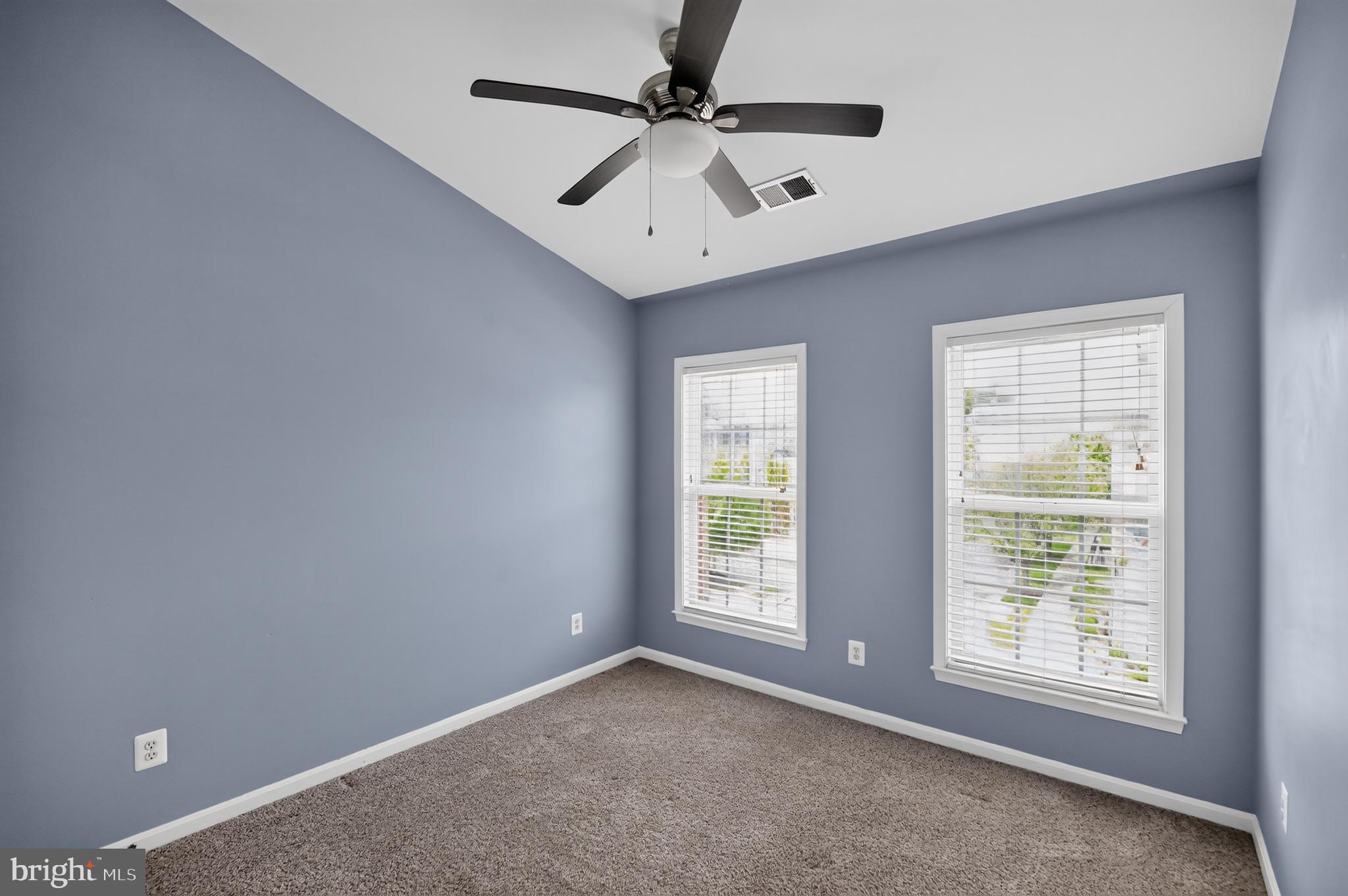 9179 Furey Road Lorton, VA 22079 - Photo 18 of 31 an empty room with windows and fan