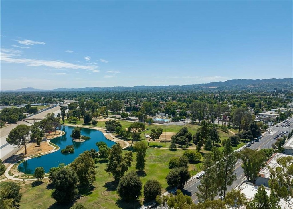 6545 Reseda Boulevard, Unit 17 Reseda, CA 91335 - Photo 13 of 13 an aerial view of a city with lots of residential buildings and mountain view in back