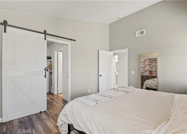 a bedroom with a bed and a table