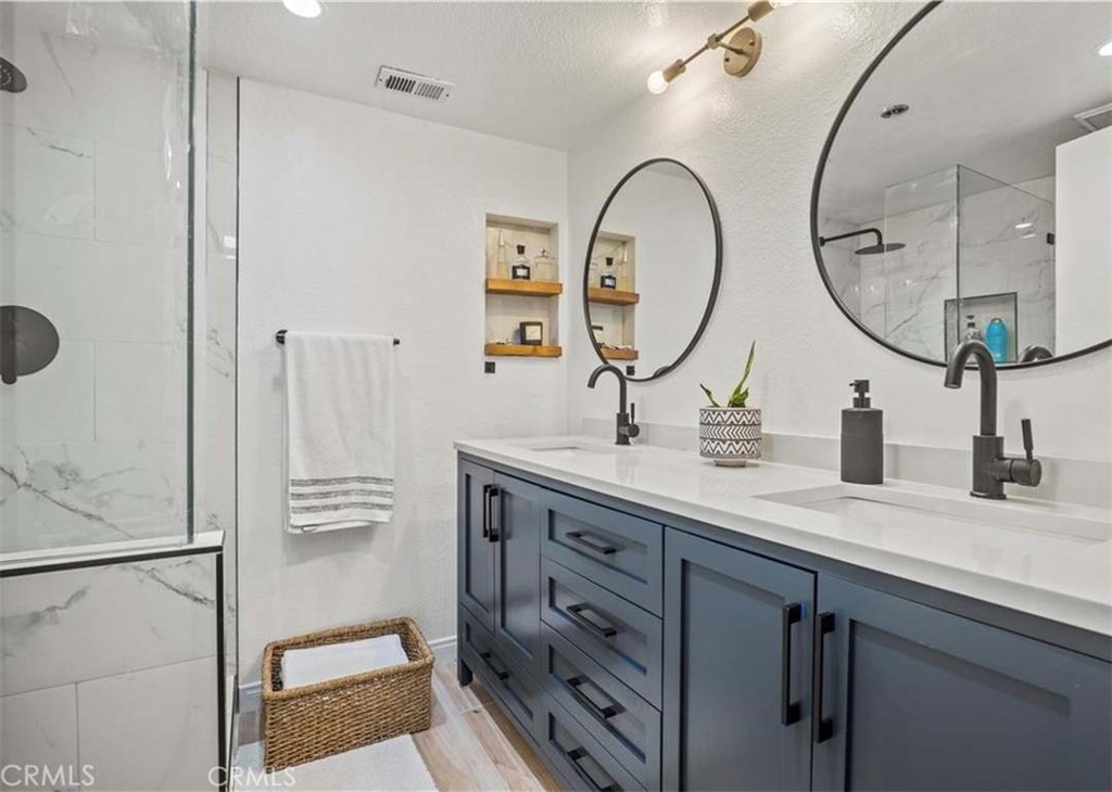 6545 Reseda Boulevard, Unit 17 Reseda, CA 91335 - Photo 7 of 13 a bathroom with a sink and a mirror