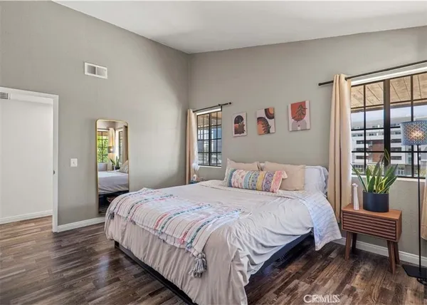 a bedroom with a bed and a couch