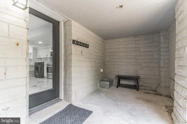 a view of a kitchen with a sink and cabinets