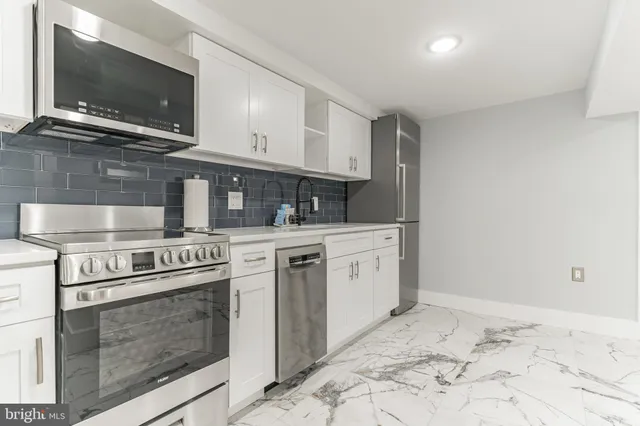 a utility room with washing machine