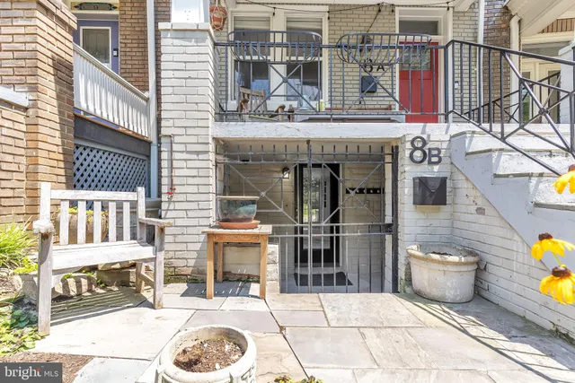 a view of a chairs and table in the patio