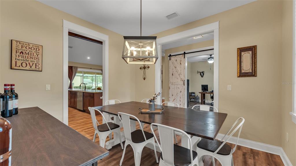 3430 North Galloway Road Lakeland, FL 33810 - Photo 11 of 84 a view of a dining room with furniture and chandelier