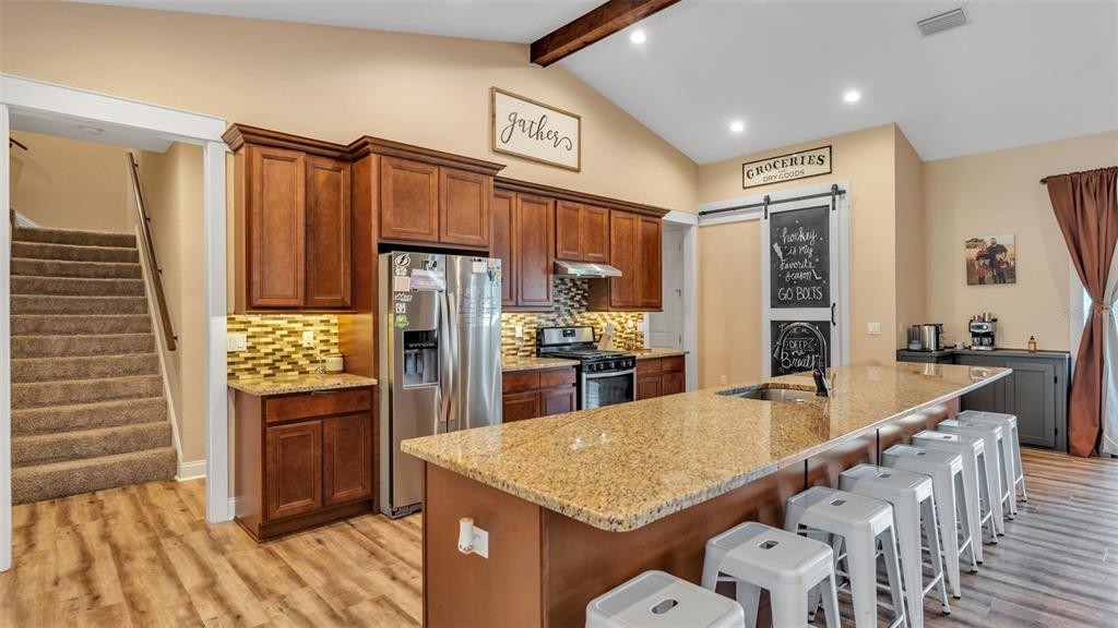 3430 North Galloway Road Lakeland, FL 33810 - Photo 12 of 84 a kitchen with refrigerator and cabinets