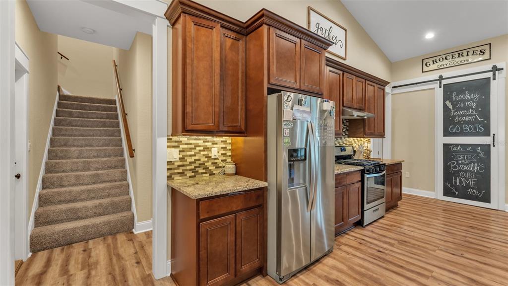 3430 North Galloway Road Lakeland, FL 33810 - Photo 17 of 84 a kitchen with stainless steel appliances granite countertop a refrigerator and a sink