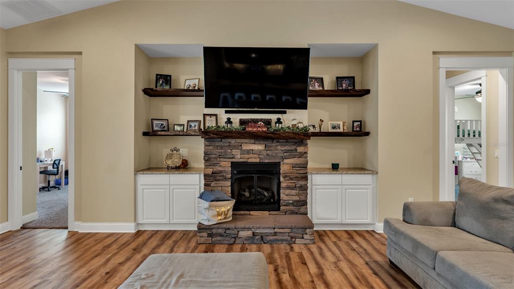3430 North Galloway Road Lakeland, FL 33810 - Photo 19 of 84 a living room with furniture and a fireplace