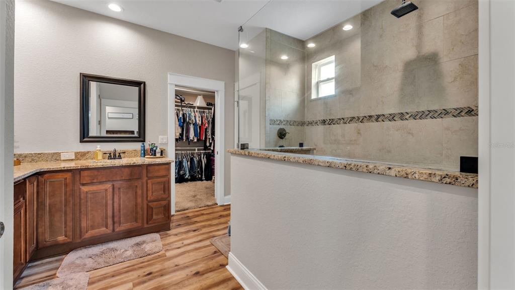 3430 North Galloway Road Lakeland, FL 33810 - Photo 25 of 84 a spacious bathroom with a granite countertop sink a mirror and a shower