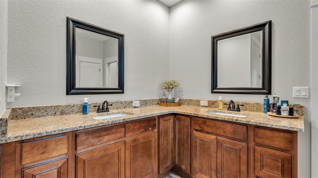 3430 North Galloway Road Lakeland, FL 33810 - Photo 26 of 84 a bathroom with 2 sink and a mirror
