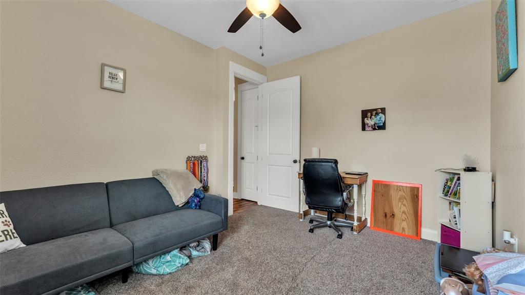 3430 North Galloway Road Lakeland, FL 33810 - Photo 35 of 84 a living room with furniture and a ceiling fan