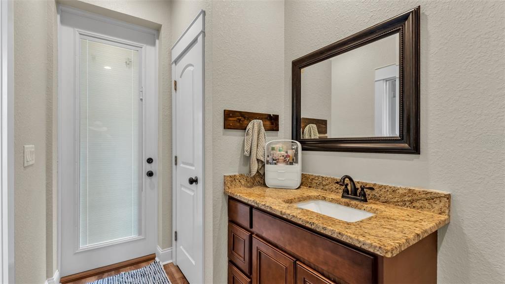 3430 North Galloway Road Lakeland, FL 33810 - Photo 39 of 84 a bathroom with a granite countertop sink and a mirror