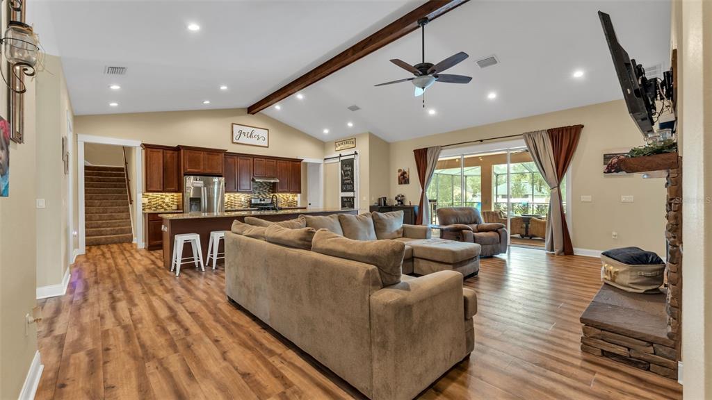 3430 North Galloway Road Lakeland, FL 33810 - Photo 4 of 84 a living room with furniture kitchen area and a wooden floor