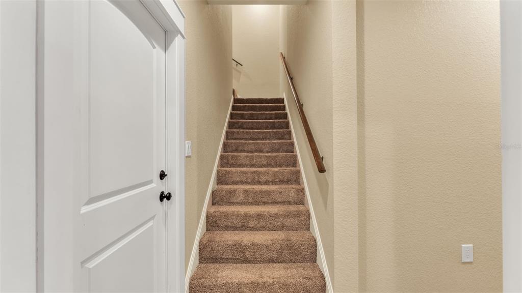 3430 North Galloway Road Lakeland, FL 33810 - Photo 46 of 84 a view of staircase with wooden floor and white walls