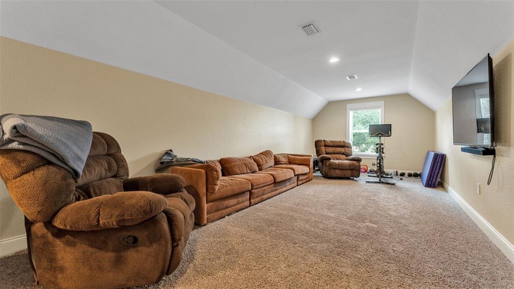 3430 North Galloway Road Lakeland, FL 33810 - Photo 47 of 84 a living room with furniture and a flat screen tv