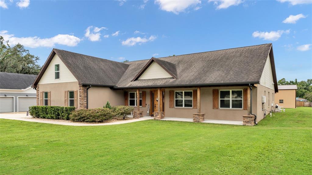 3430 North Galloway Road Lakeland, FL 33810 - Photo 65 of 84 a front view of a house with a garden