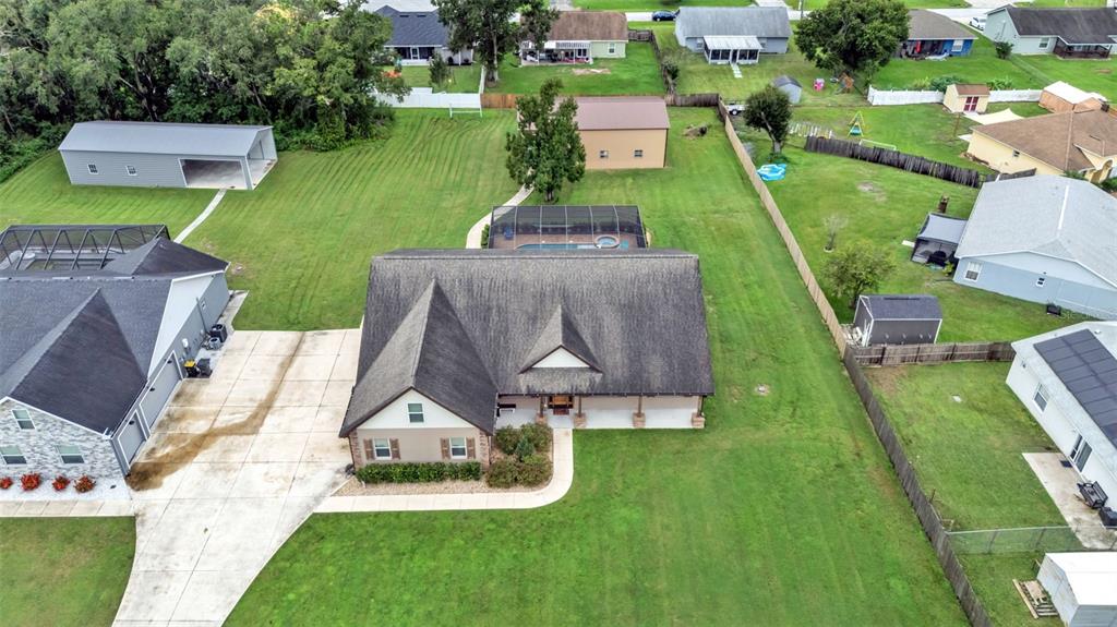 3430 North Galloway Road Lakeland, FL 33810 - Photo 71 of 84 an aerial view of a house with a garden and swimming pool