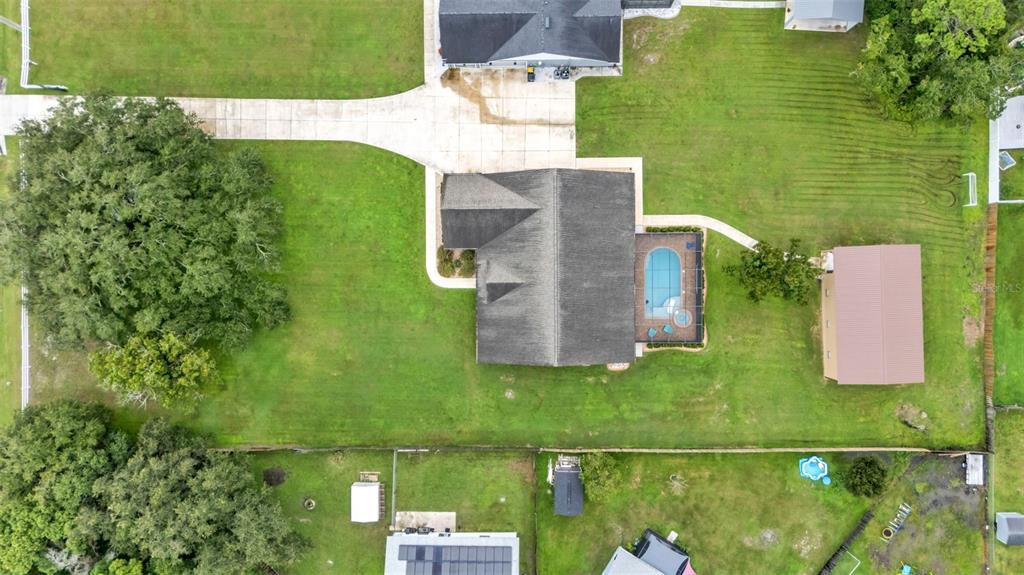 3430 North Galloway Road Lakeland, FL 33810 - Photo 76 of 84 an aerial view of a house with a yard lake view and boat