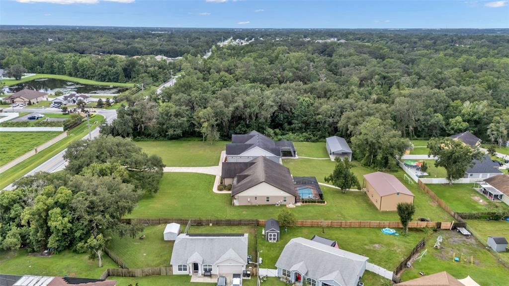 3430 North Galloway Road Lakeland, FL 33810 - Photo 77 of 84 an aerial view of a house with a garden and lake view