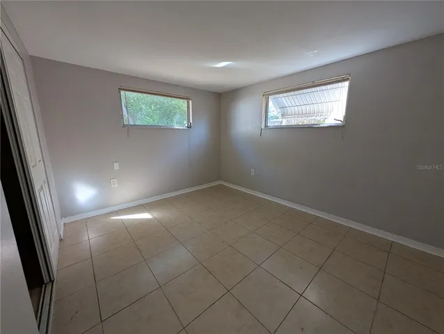 an empty room with windows