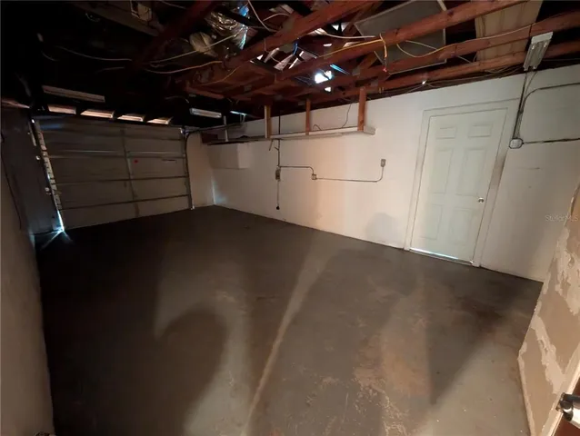 a view of an empty room with a large window