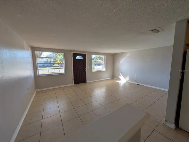 a view of an empty room and window