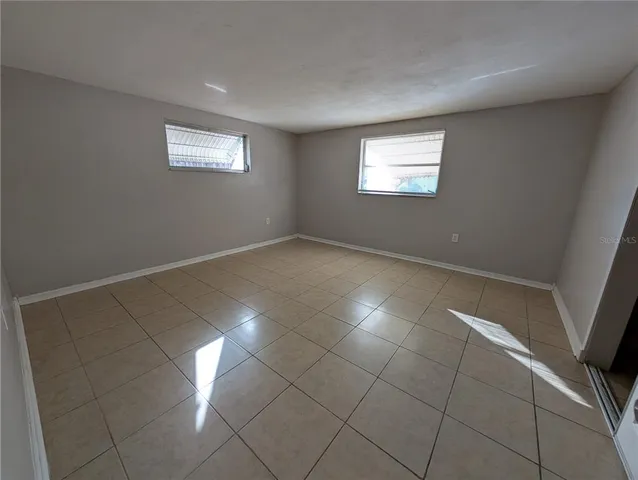 a view of an empty room and window