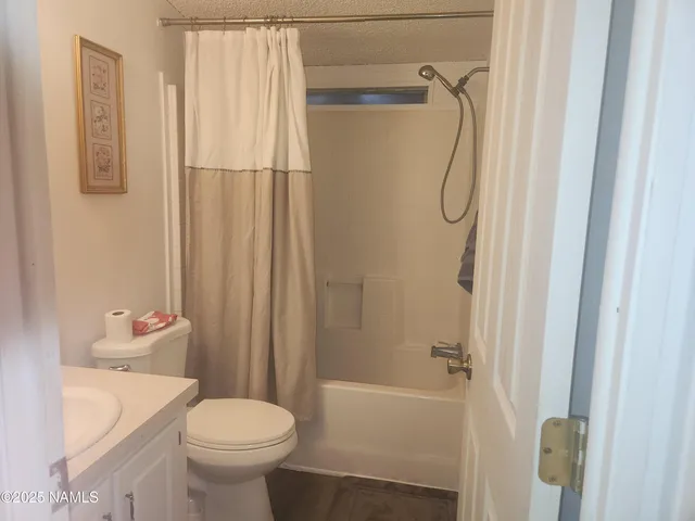 a room with a table chairs and a wooden floor