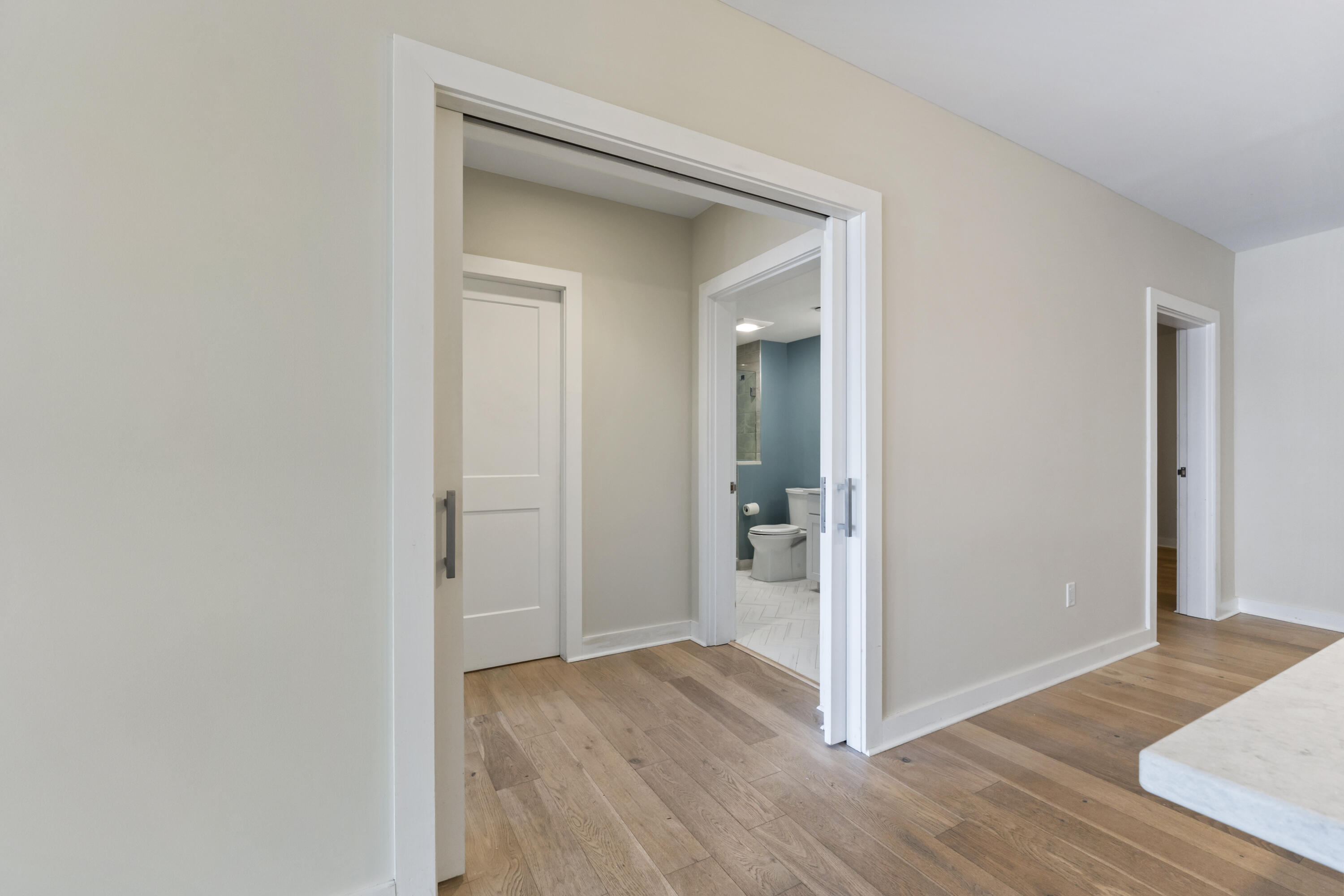 62 India Street, Unit 203 Portland, ME 04101 - Photo 16 of 67 Pocket Doors to Primary Bedroom