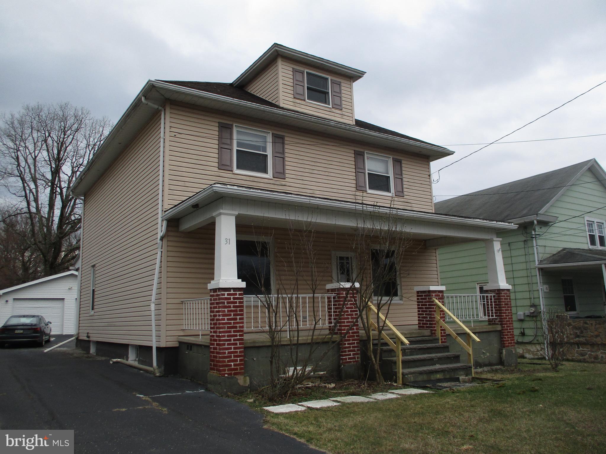 31 Village Road Shenandoah, PA 17976 - Photo 2 of 20 a front view of a house with a yard
