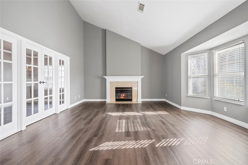849 Balboa Drive Arcadia, CA 91007 - Photo 11 of 54 a view of an empty room with wooden floor fireplace and a window