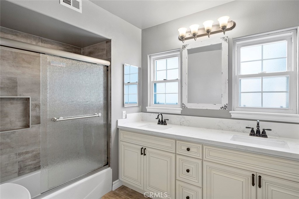 849 Balboa Drive Arcadia, CA 91007 - Photo 16 of 54 a bathroom with a sink double vanity mirror and a bathtub