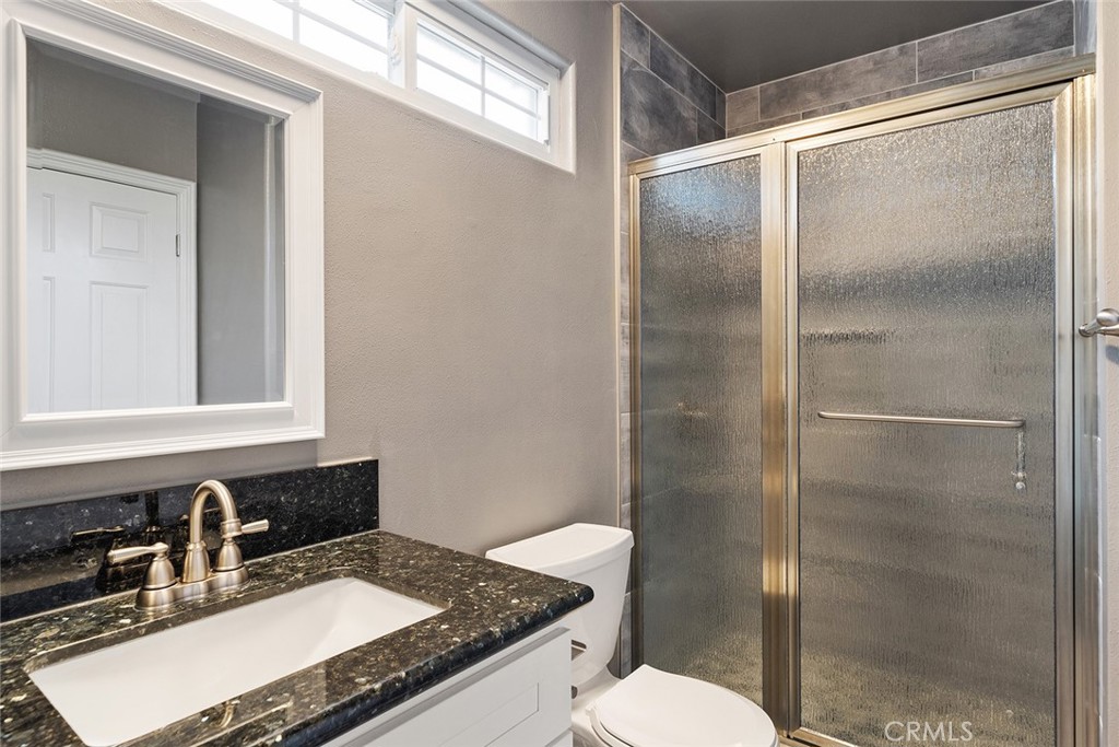 849 Balboa Drive Arcadia, CA 91007 - Photo 20 of 54 a bathroom with a granite countertop sink toilet and shower