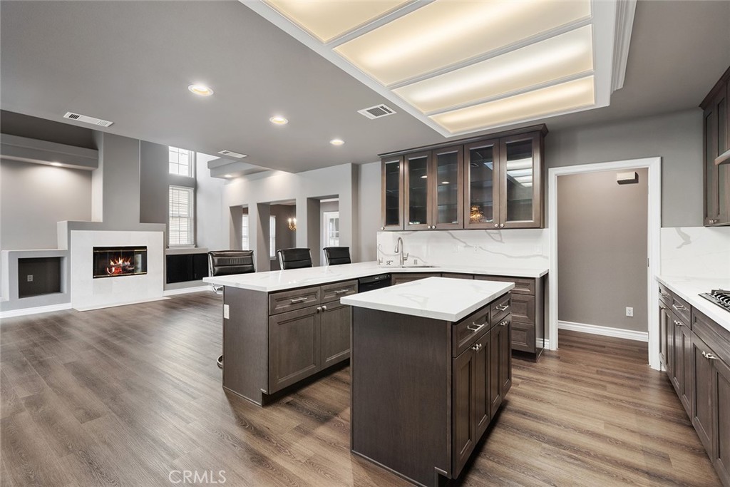 849 Balboa Drive Arcadia, CA 91007 - Photo 22 of 54 a kitchen with stainless steel appliances granite countertop a stove and a refrigerator