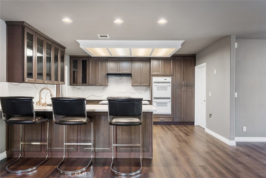 849 Balboa Drive Arcadia, CA 91007 - Photo 24 of 54 a kitchen with stainless steel appliances kitchen island granite countertop a stove and cabinets