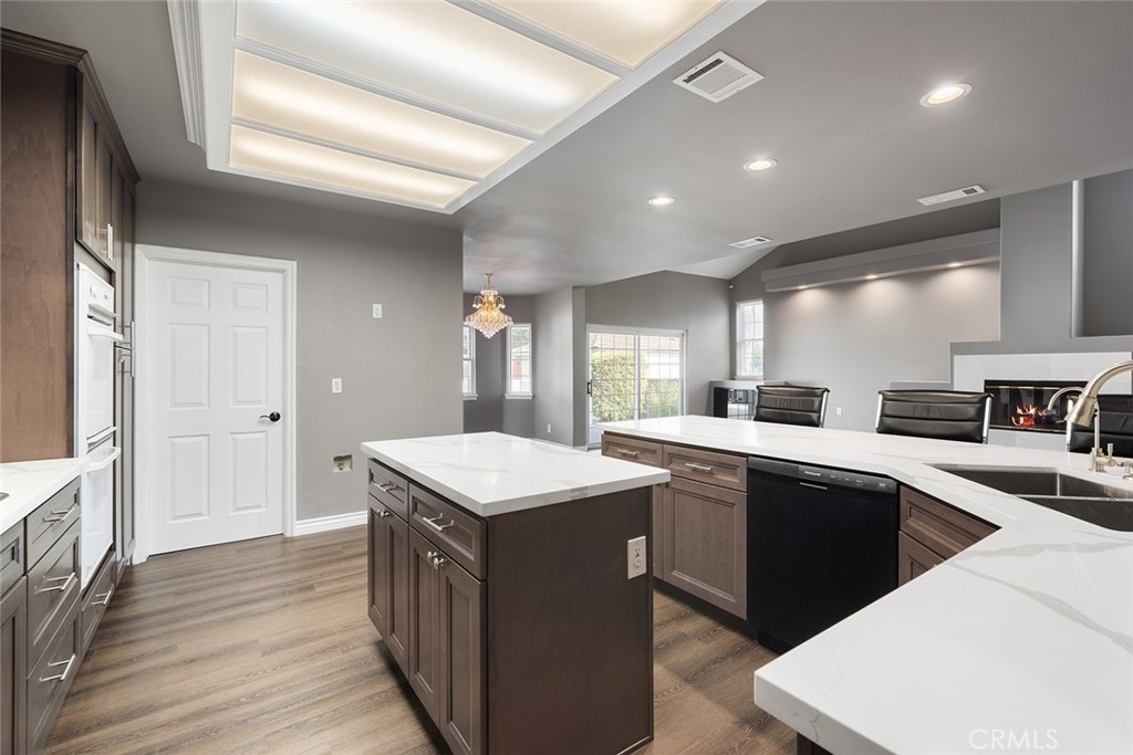 849 Balboa Drive Arcadia, CA 91007 - Photo 26 of 54 a kitchen with a sink stove and wooden cabinets