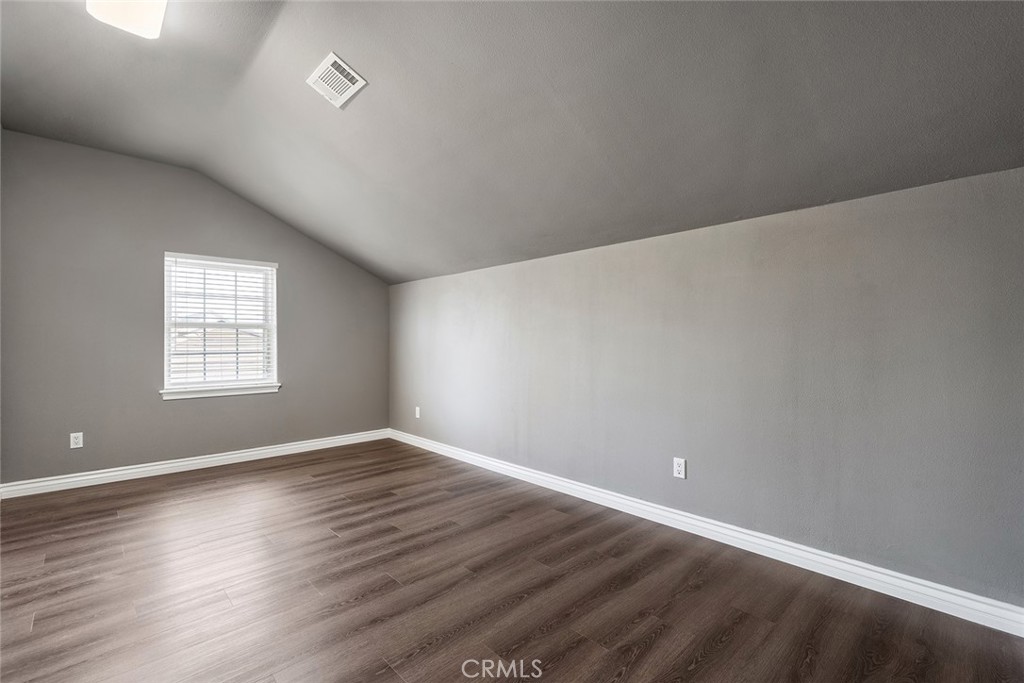 849 Balboa Drive Arcadia, CA 91007 - Photo 43 of 54 an empty room with wooden floor and windows