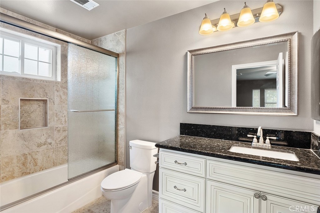 849 Balboa Drive Arcadia, CA 91007 - Photo 47 of 54 a bathroom with a granite countertop sink a toilet a mirror and shower