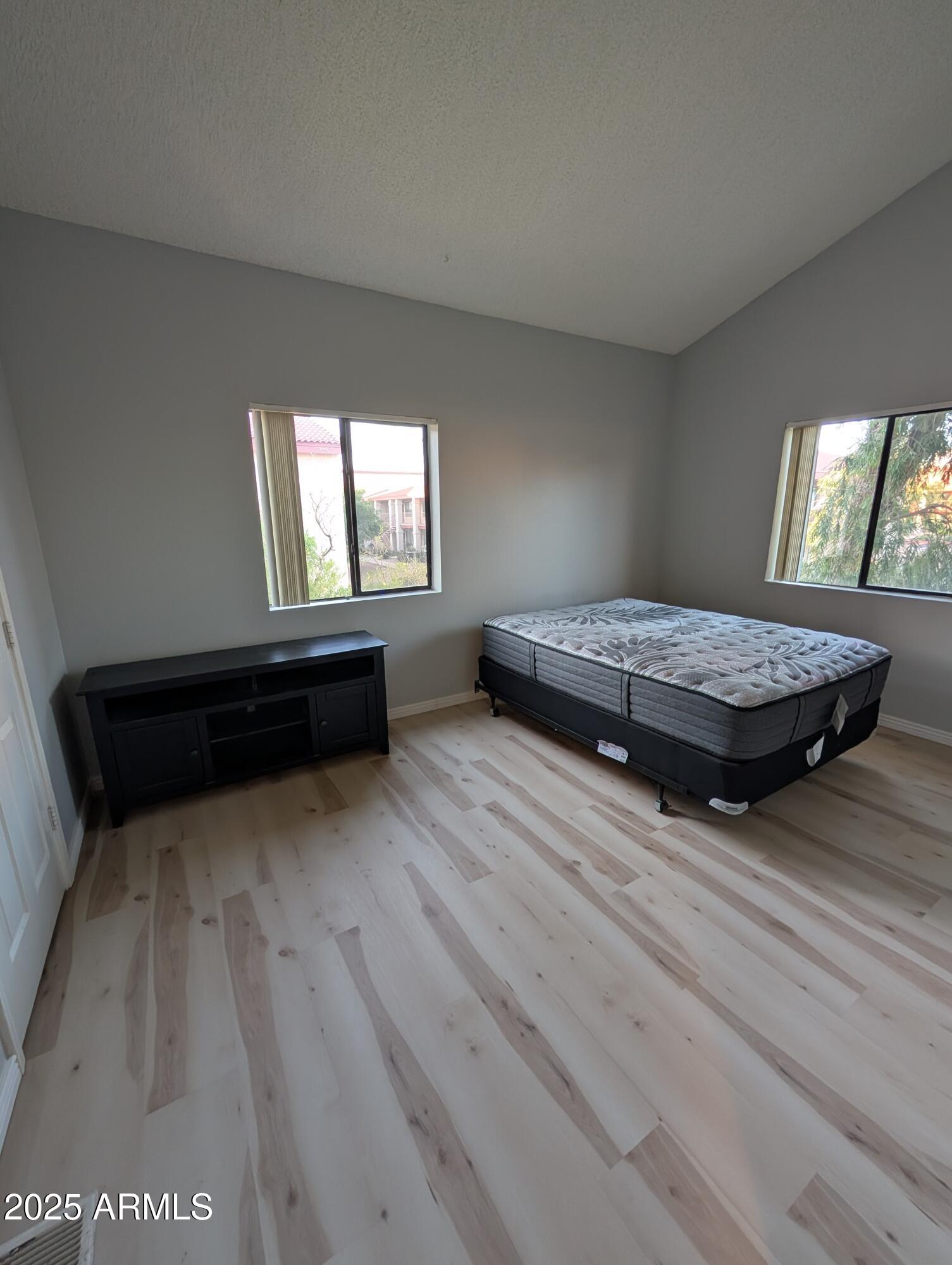 1440 North Idaho Road, Unit 2050 Apache Junction, AZ 85119 - Photo 11 of 21 a living room with furniture and a wooden floor