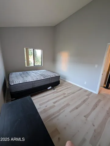 a bedroom with a bed and window