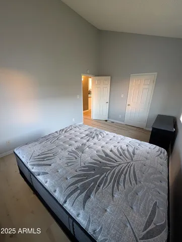 a bedroom with a bed and window