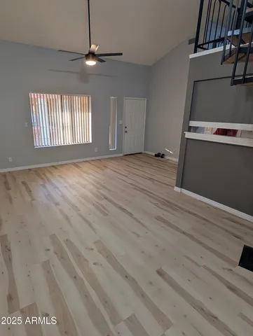 a view of an empty room with a window