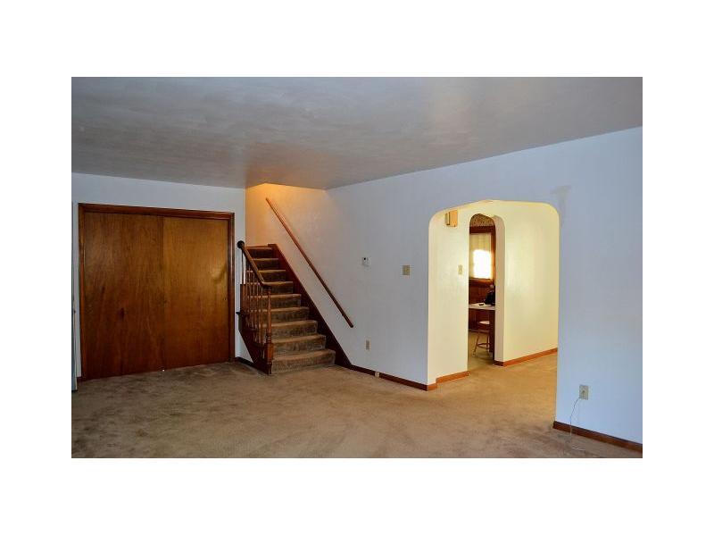 225 Ridge Road Sewickley, PA 15143 - Photo 7 of 25 Living Room. There are three entry closets in the living room. A short set of steps leads to the bedroom level of the home.