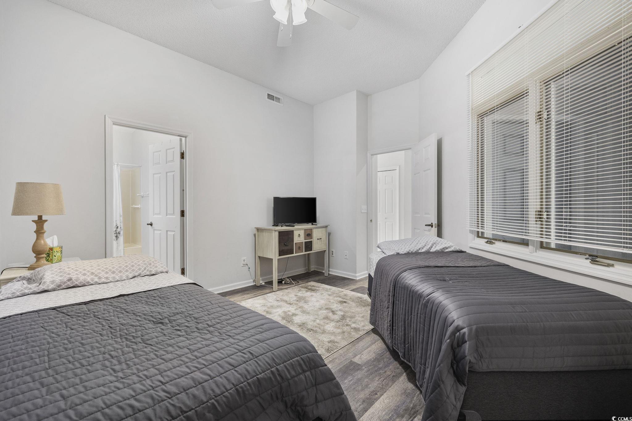 1221 Tidewater Drive, Unit 412 North Myrtle Beach, SC 29582 - Photo 21 of 36 Bedroom with wood finished floors and ceiling fan