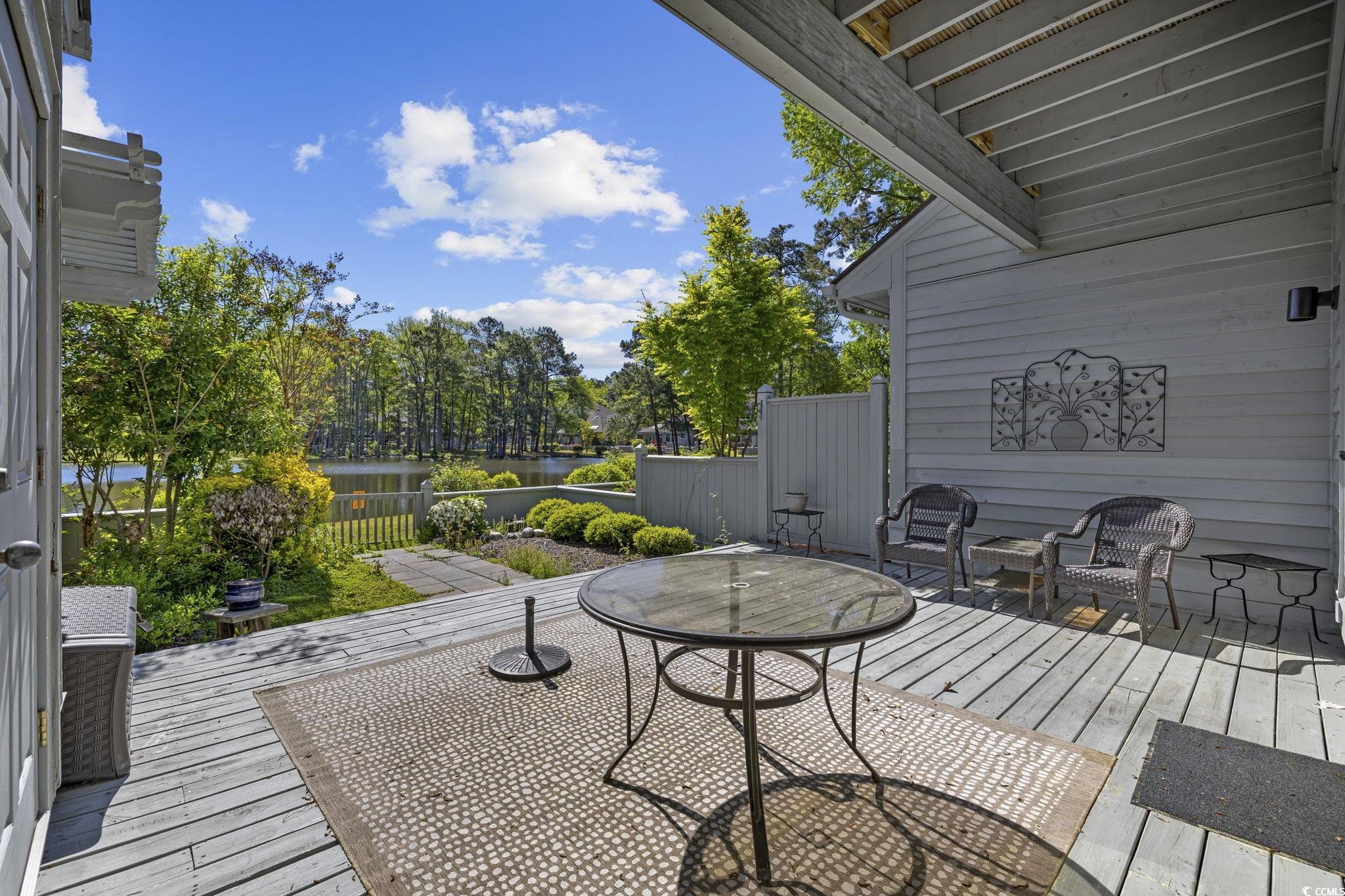 1221 Tidewater Drive, Unit 412 North Myrtle Beach, SC 29582 - Photo 24 of 36 Wooden terrace with a water view