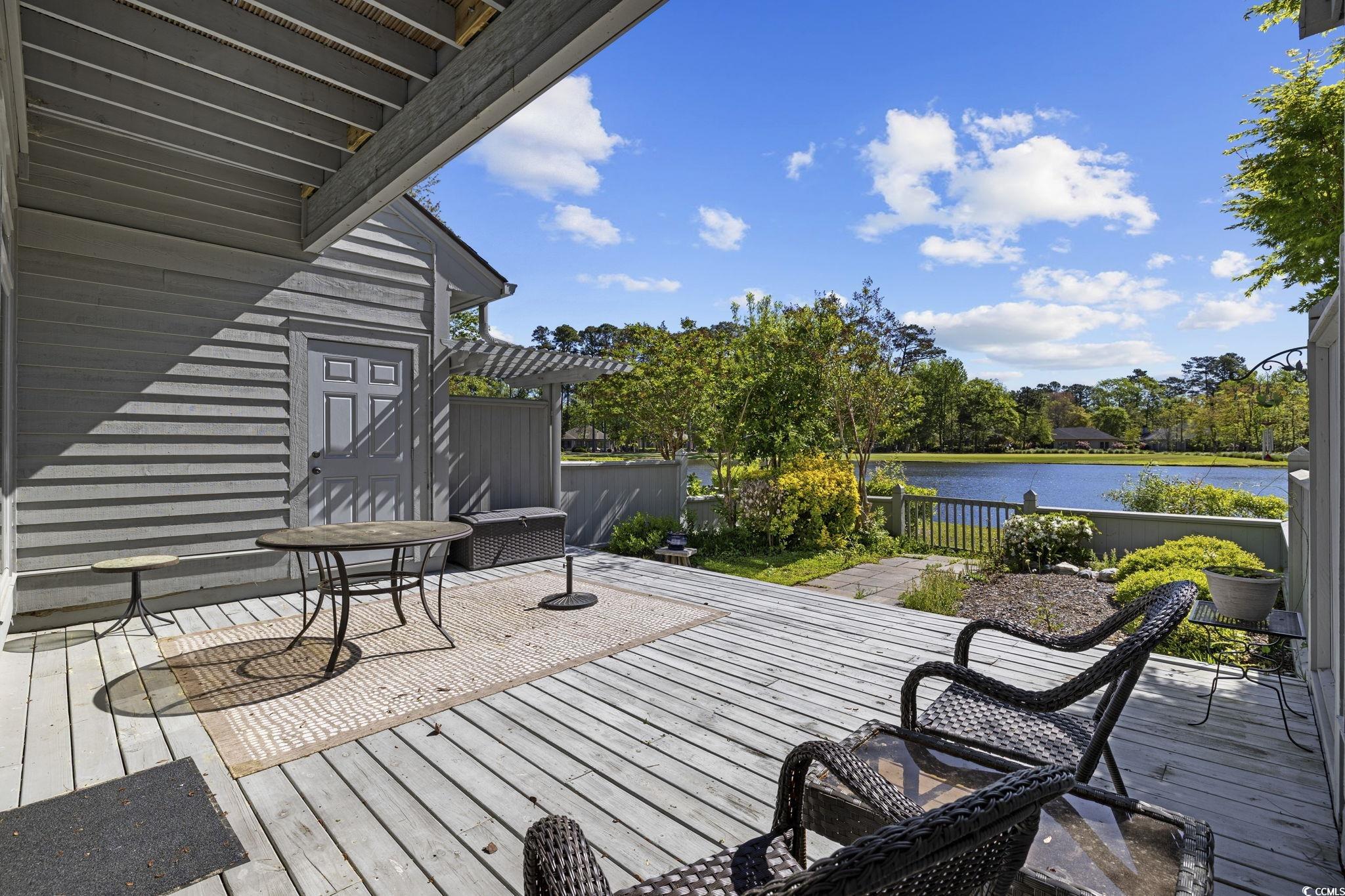 1221 Tidewater Drive, Unit 412 North Myrtle Beach, SC 29582 - Photo 25 of 36 Wooden deck with a water view