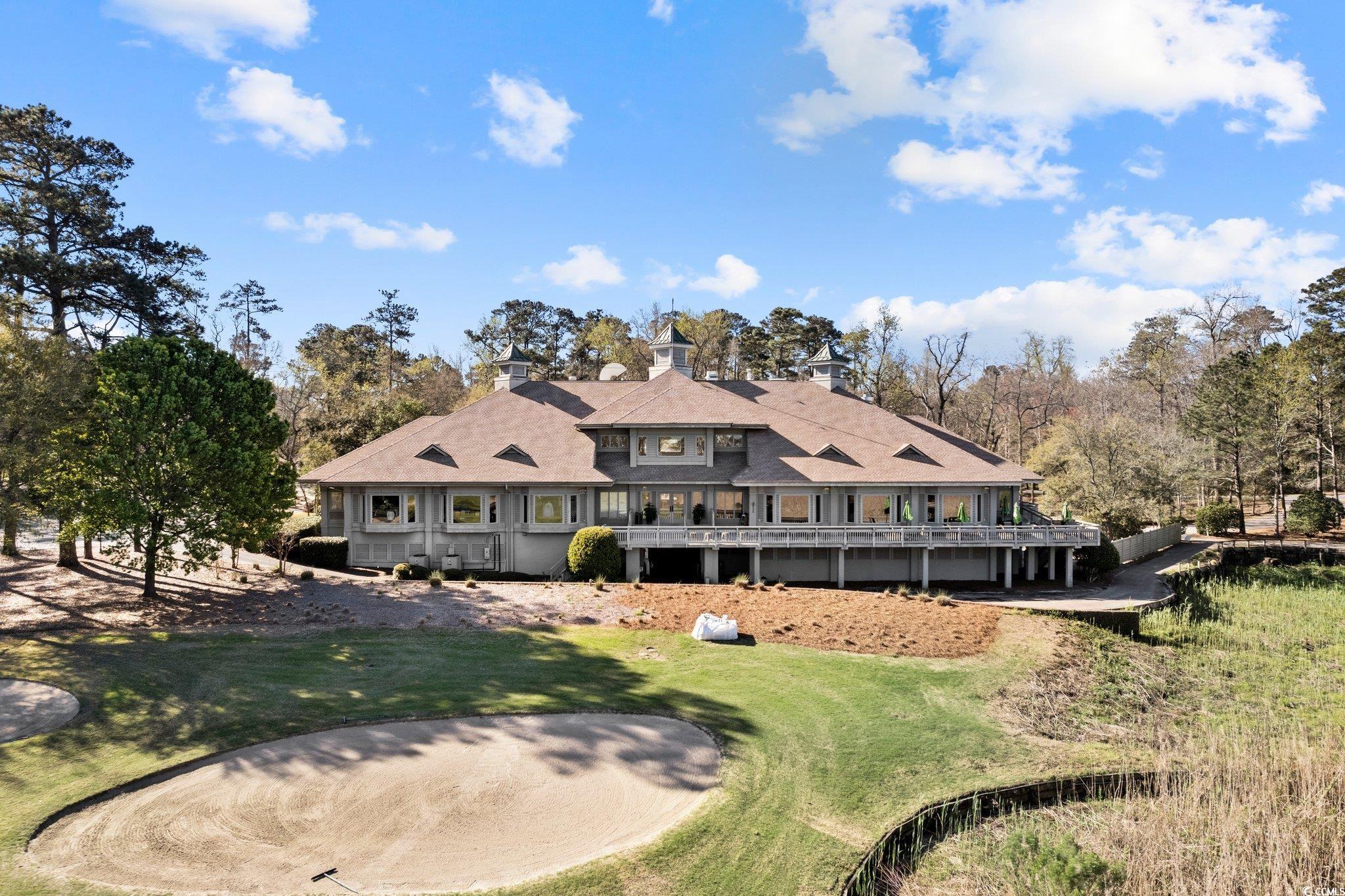 1221 Tidewater Drive, Unit 412 North Myrtle Beach, SC 29582 - Photo 33 of 36 View of patio with a pergola, outdoor dining space, and a community pool