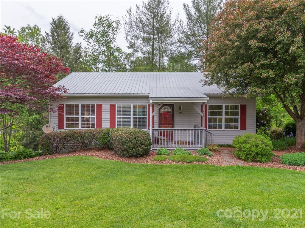 100 Ridgeline Road Clyde, NC 28721 - Photo 1 of 26 a view of a house with a yard and plants